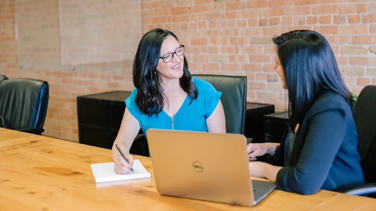 Financial advisors meeting for a European AI search visibility program